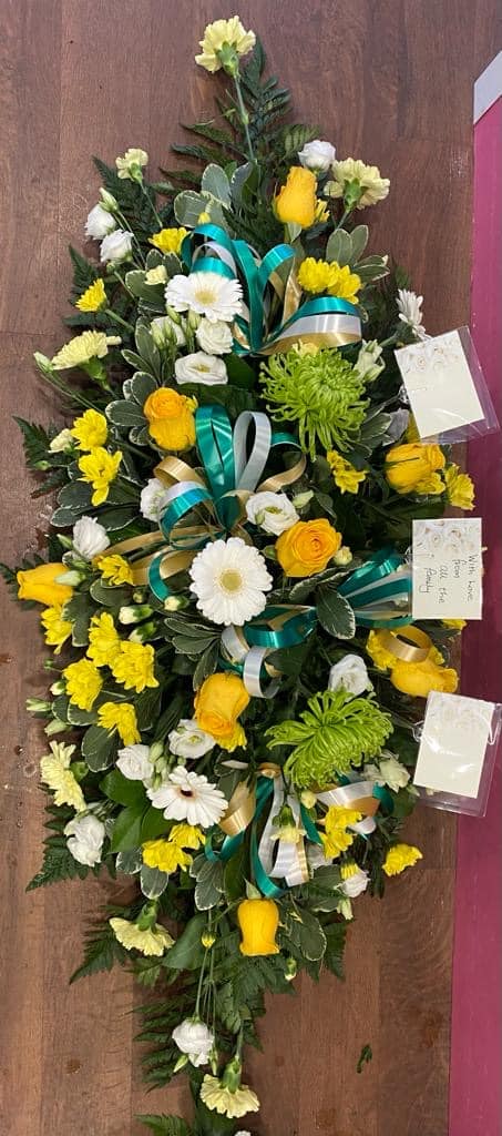 green white yellow casket spray