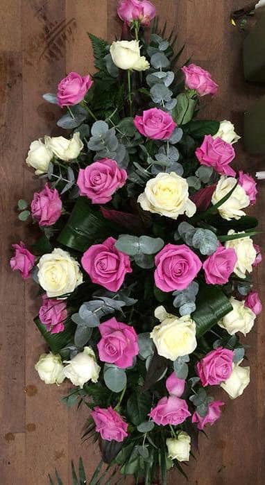 pink white rose casket spray