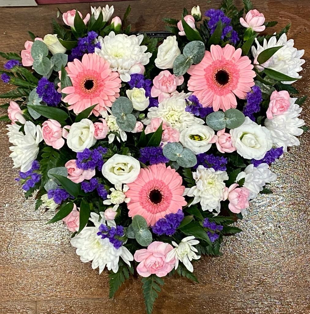 pink purple and white heart of flowers