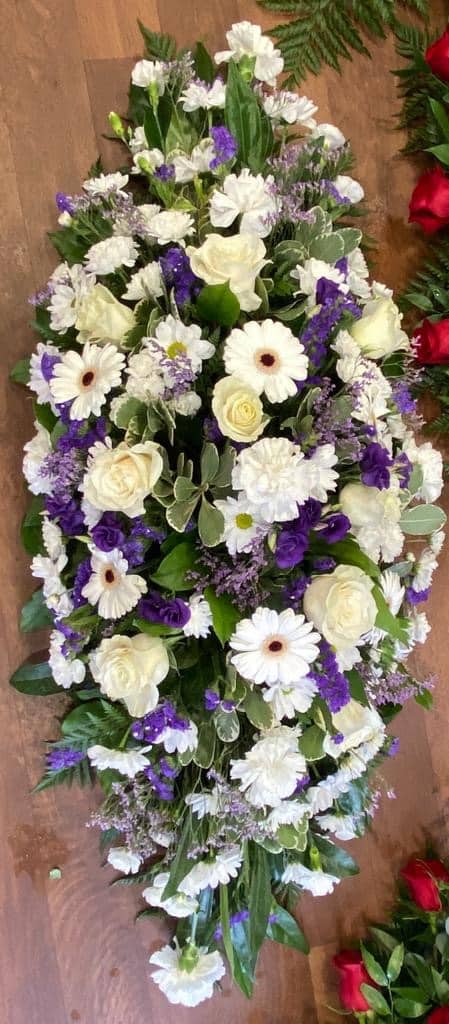 purple white casket spray