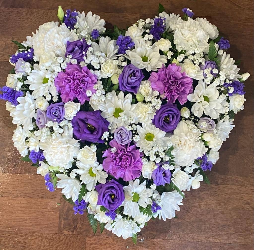 purple and white heart of flowers