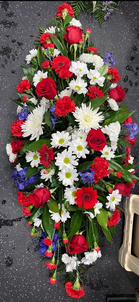 red white and blue casket spray