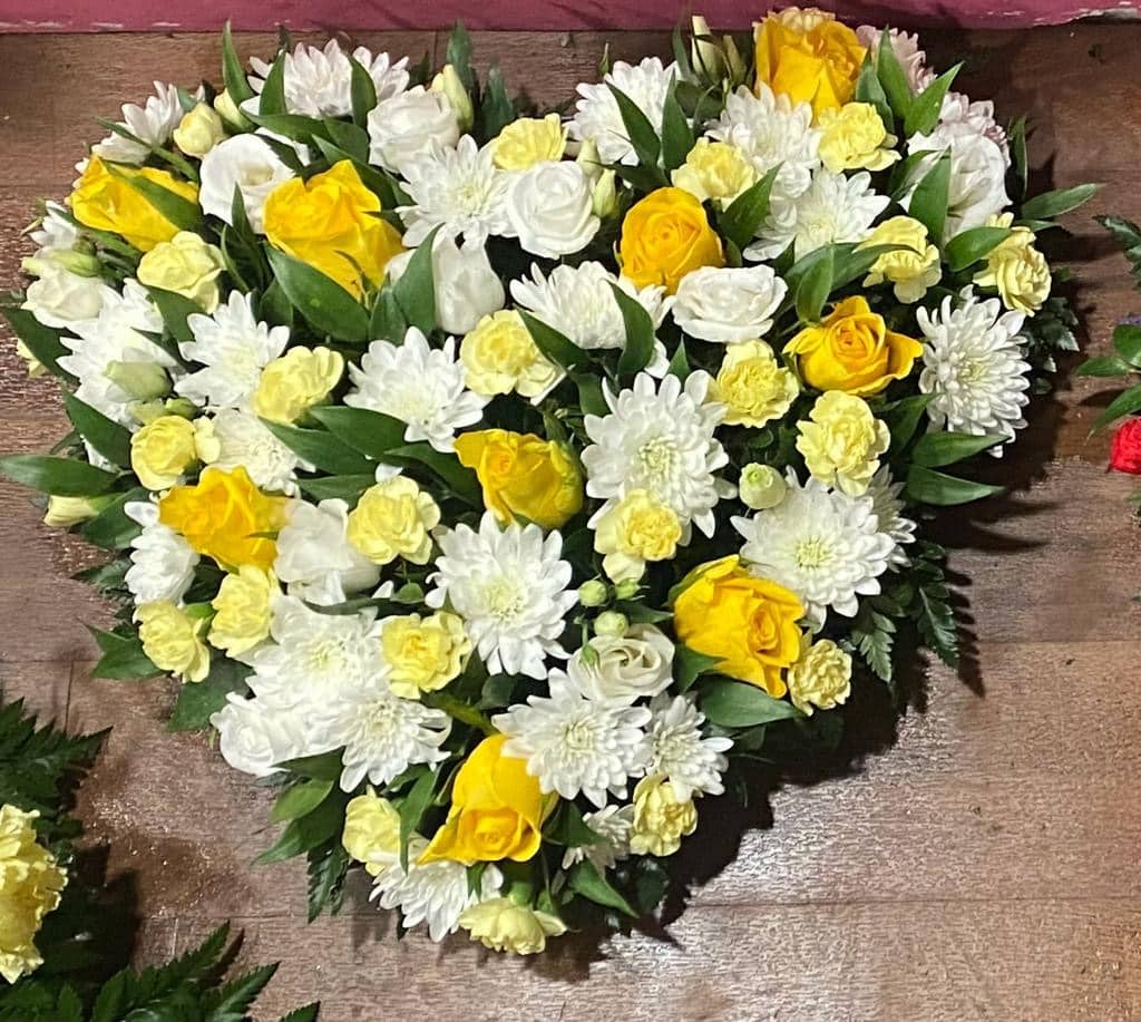 yellow and white heart of flowers